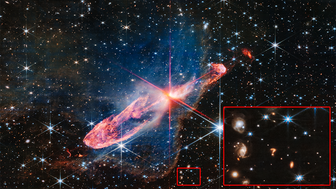 A star which looks like a question mark, with many stars and galaxies in the fore and background. A star which looks like a question mark, with many stars and galaxies in the fore and background.